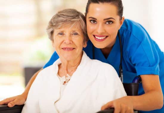 Happy Orpea worker with resident